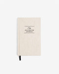 Beige journal with 'The Five Minute Journal' text on a white background