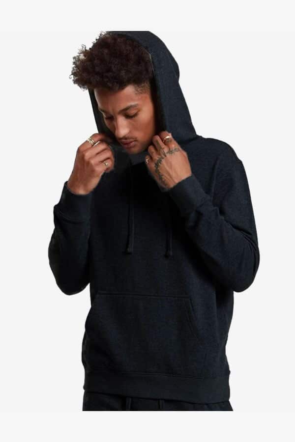 Person wearing a black hoodie on a white background